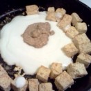 Add yoghurt and mustard to the tofu